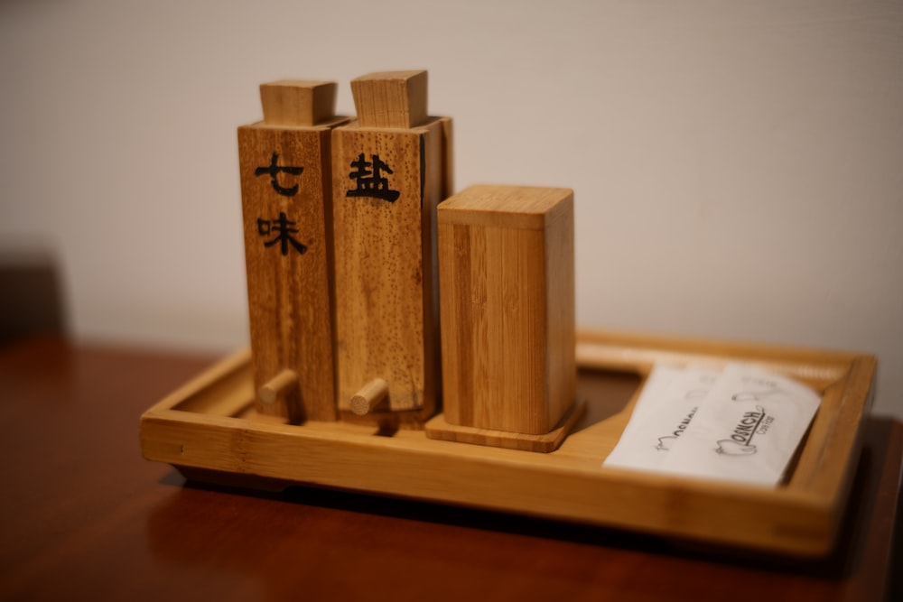a couple of wooden blocks sitting on top of a wooden tray