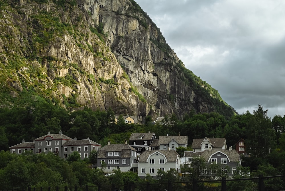 a large mountain with houses on the side of it