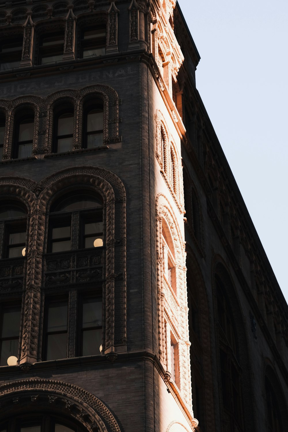 a tall building with a clock on the front of it