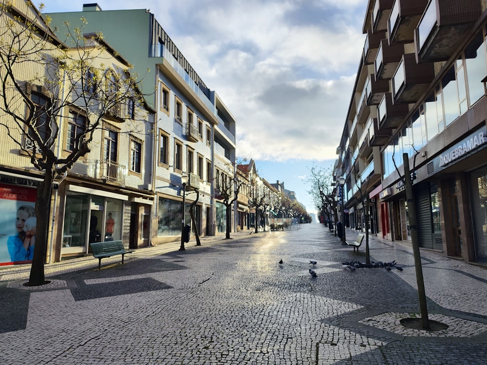 a city street lined with tall buildings and shops