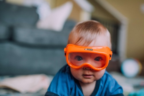 a small child wearing a pair of goggles