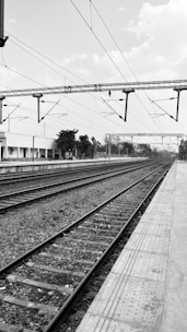 a black and white photo of a train track