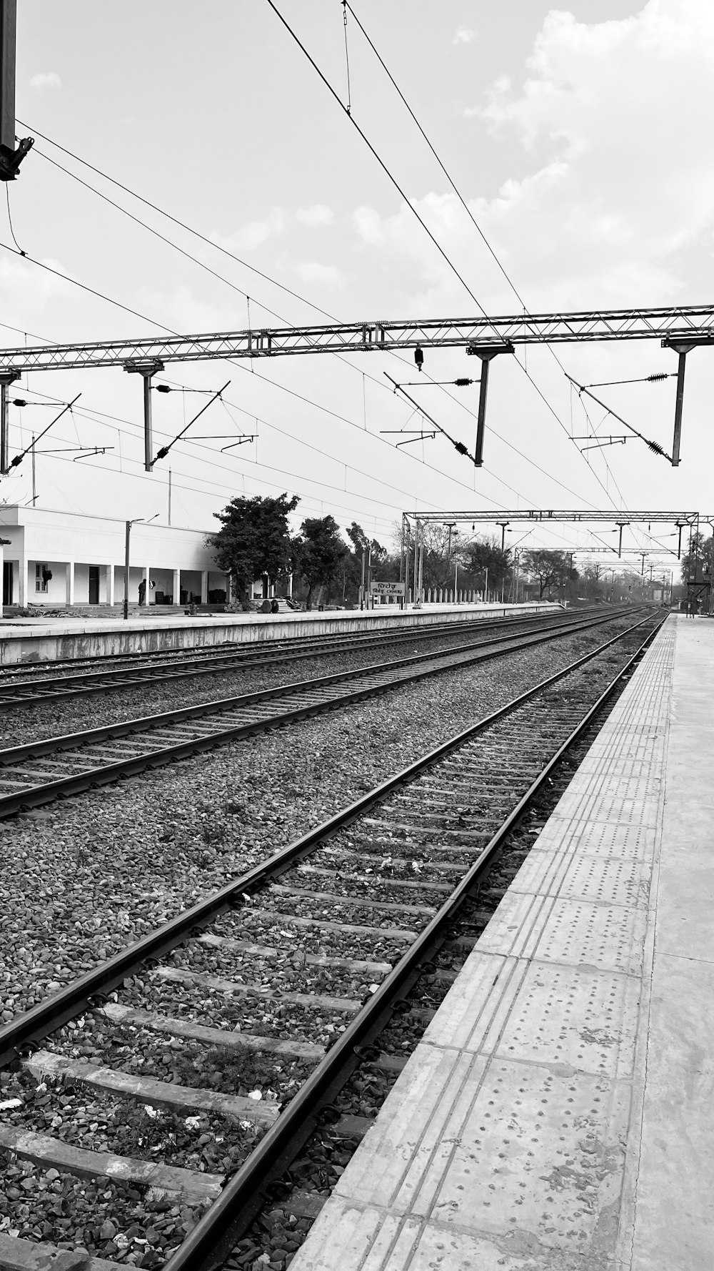 a black and white photo of a train track