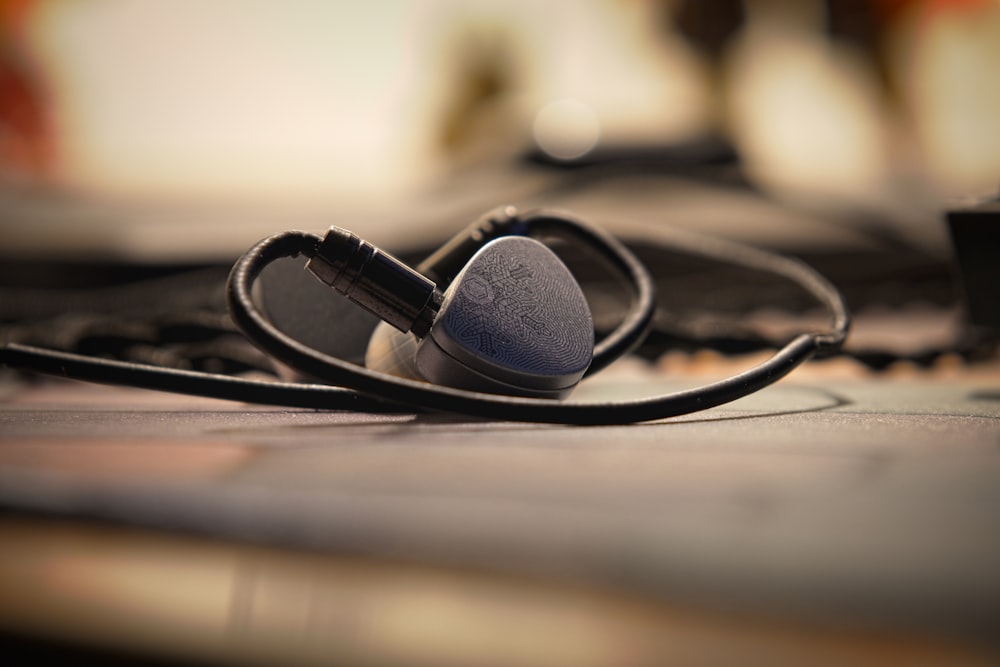 a pair of ear buds sitting on top of a table