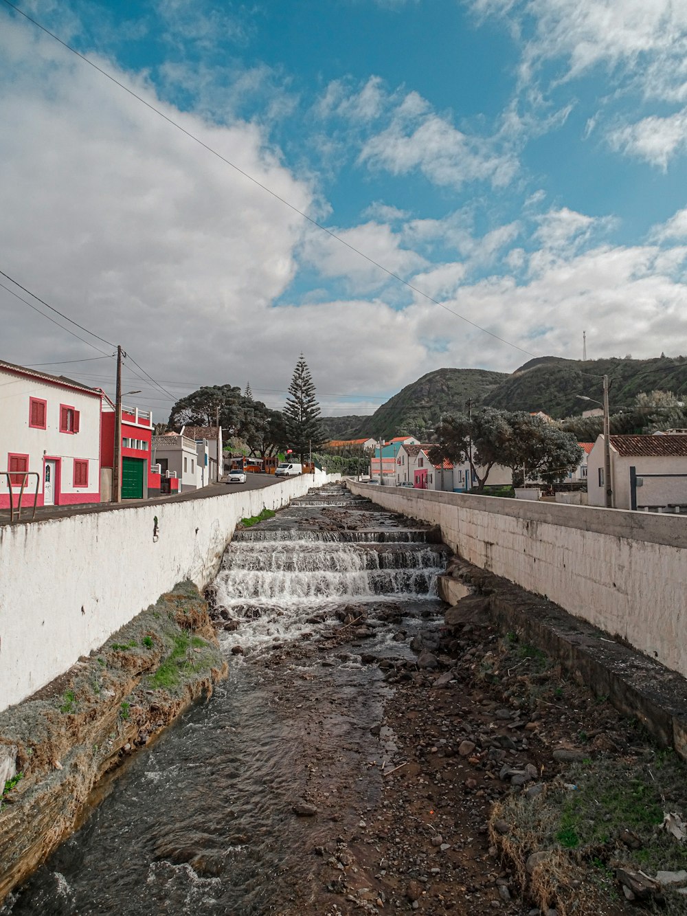 a small stream running through a small town