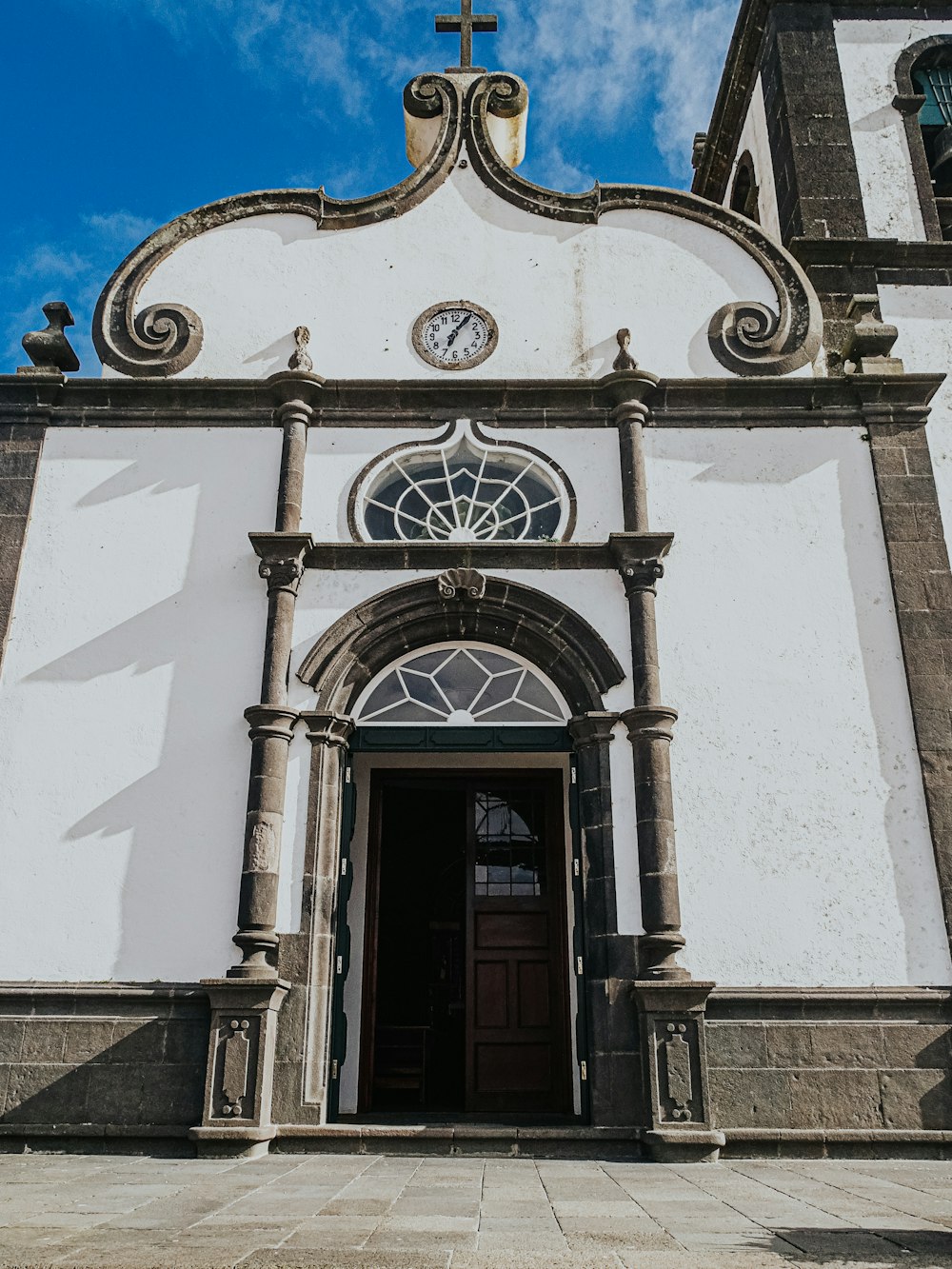 a large white church with a cross on top of it