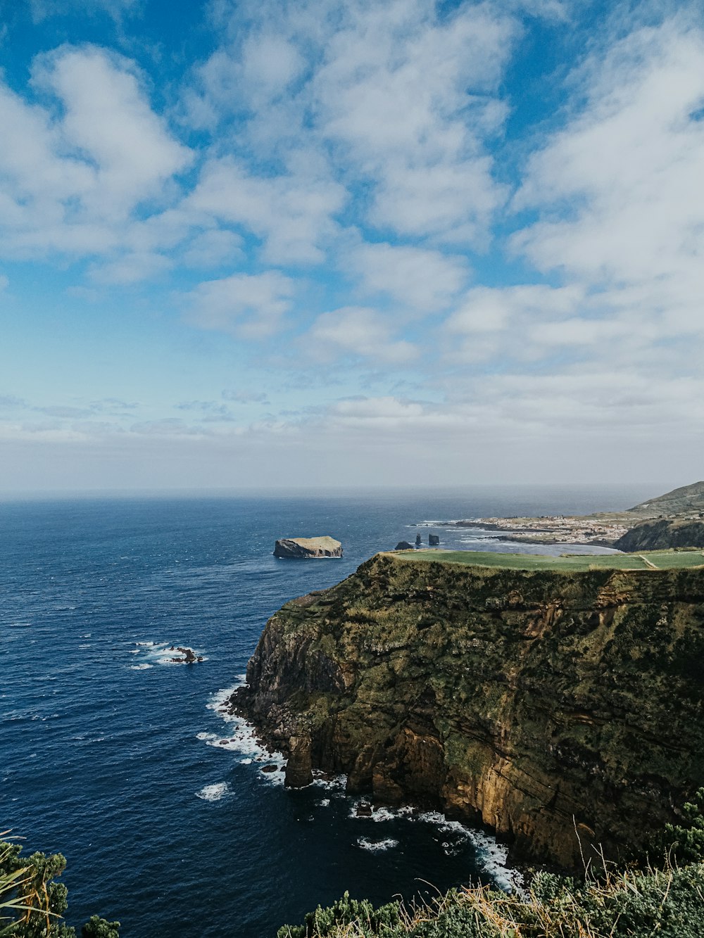 a scenic view of the ocean and cliffs
