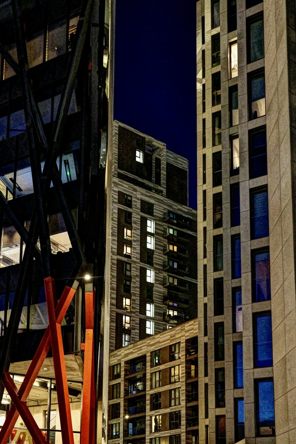 a view of some very tall buildings at night