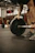 a man lifting a barbell in a gym