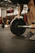 a man lifting a barbell in a gym