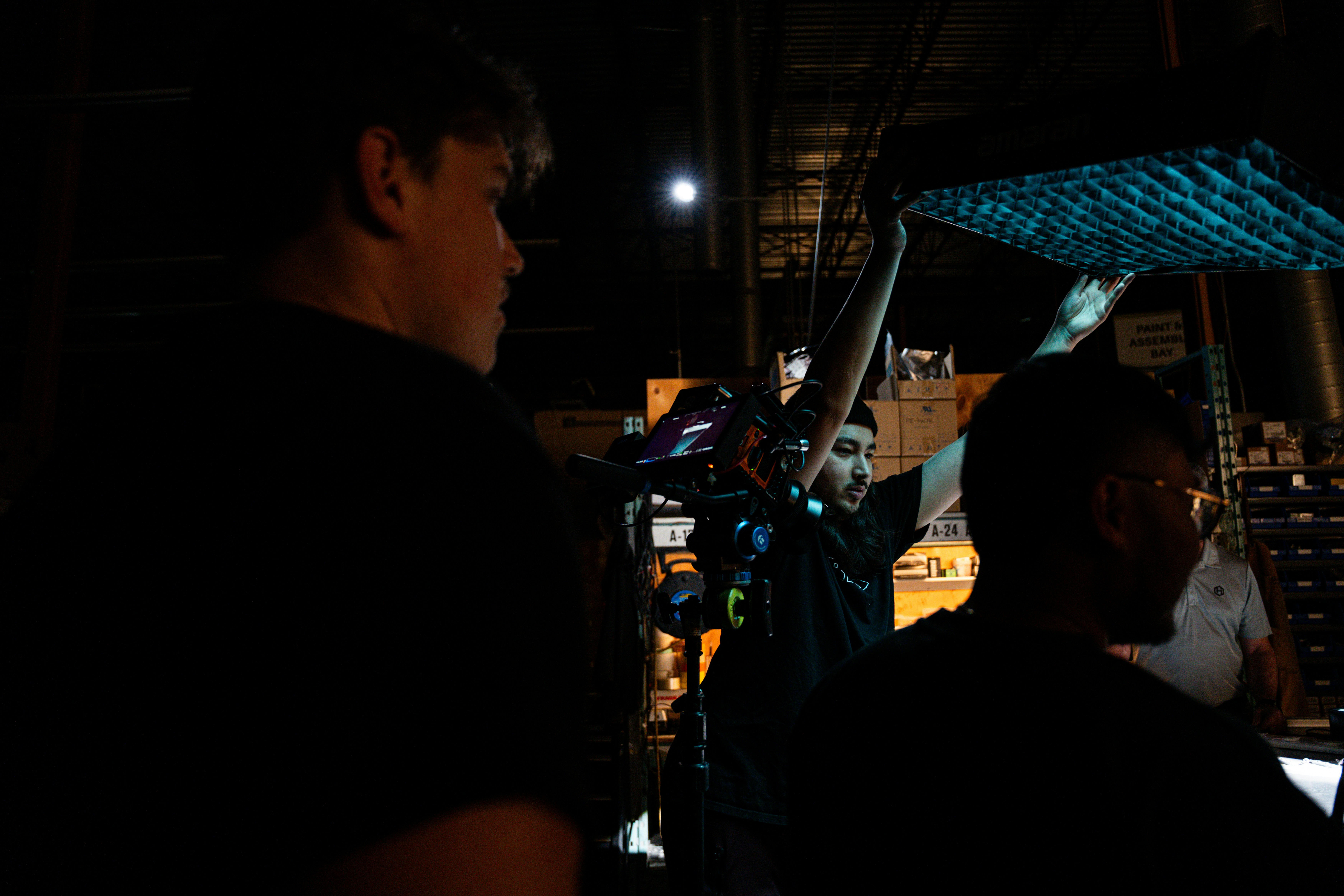 a group of people standing around a building in the dark