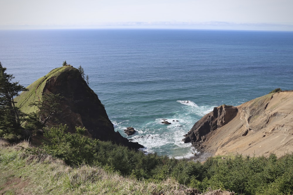 a view of the ocean from the top of a hill