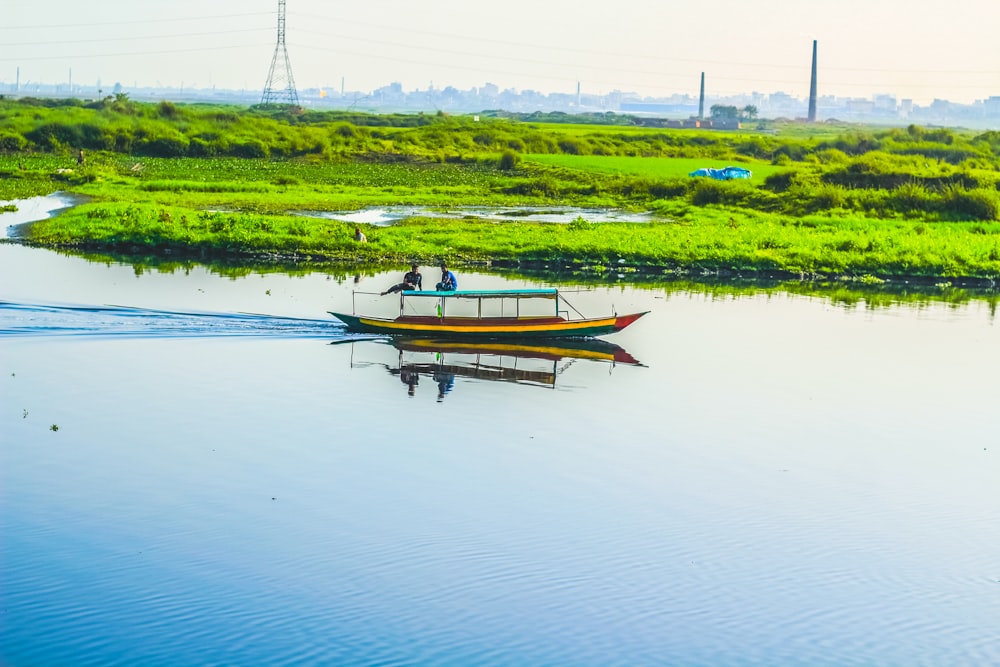 a small boat floating on top of a body of water