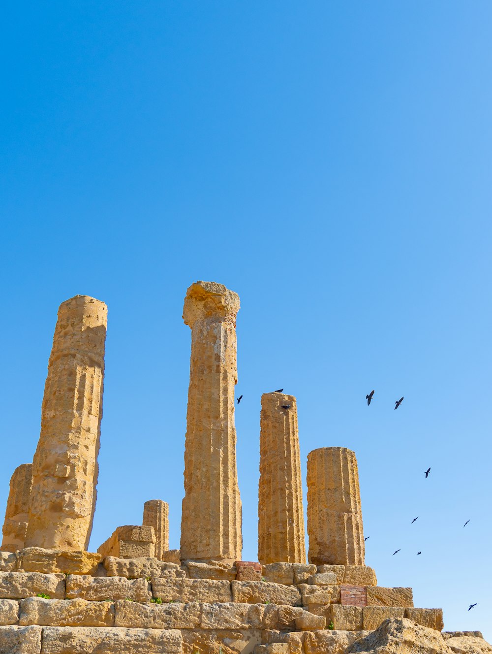 a group of stone pillars sitting next to each other