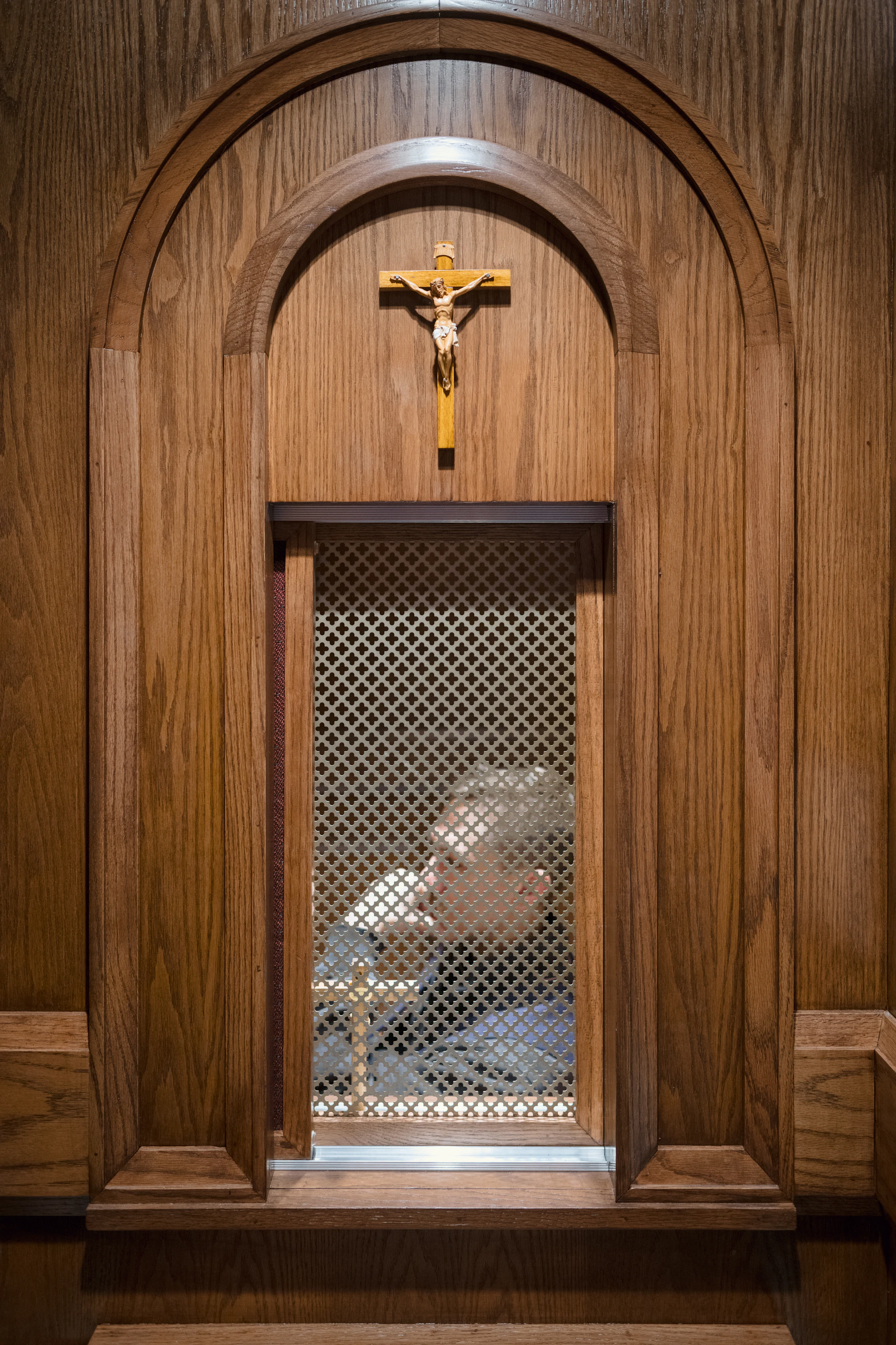 a wooden wall with a crucifix on it