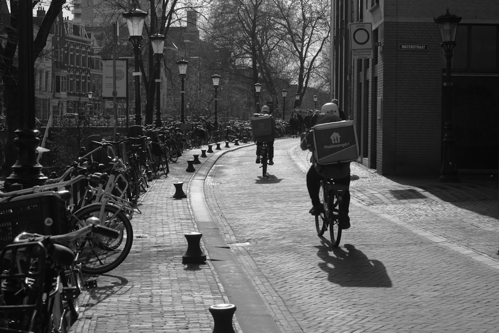 a person riding a bike down a street