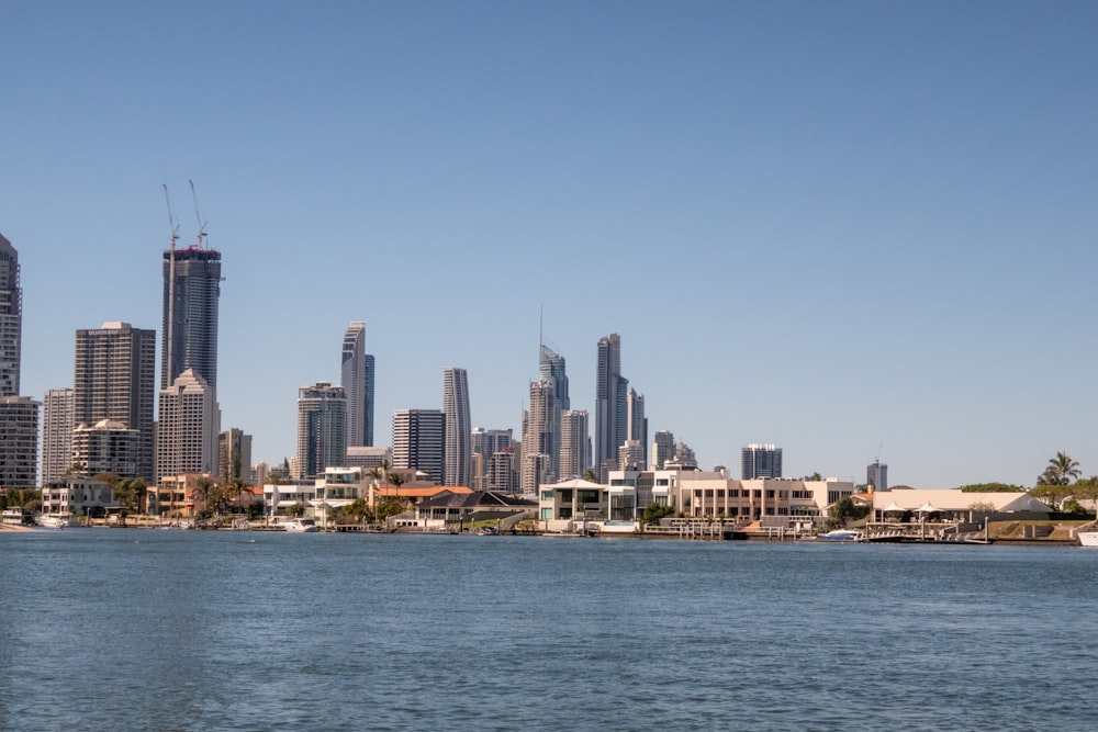 a large body of water with a city in the background