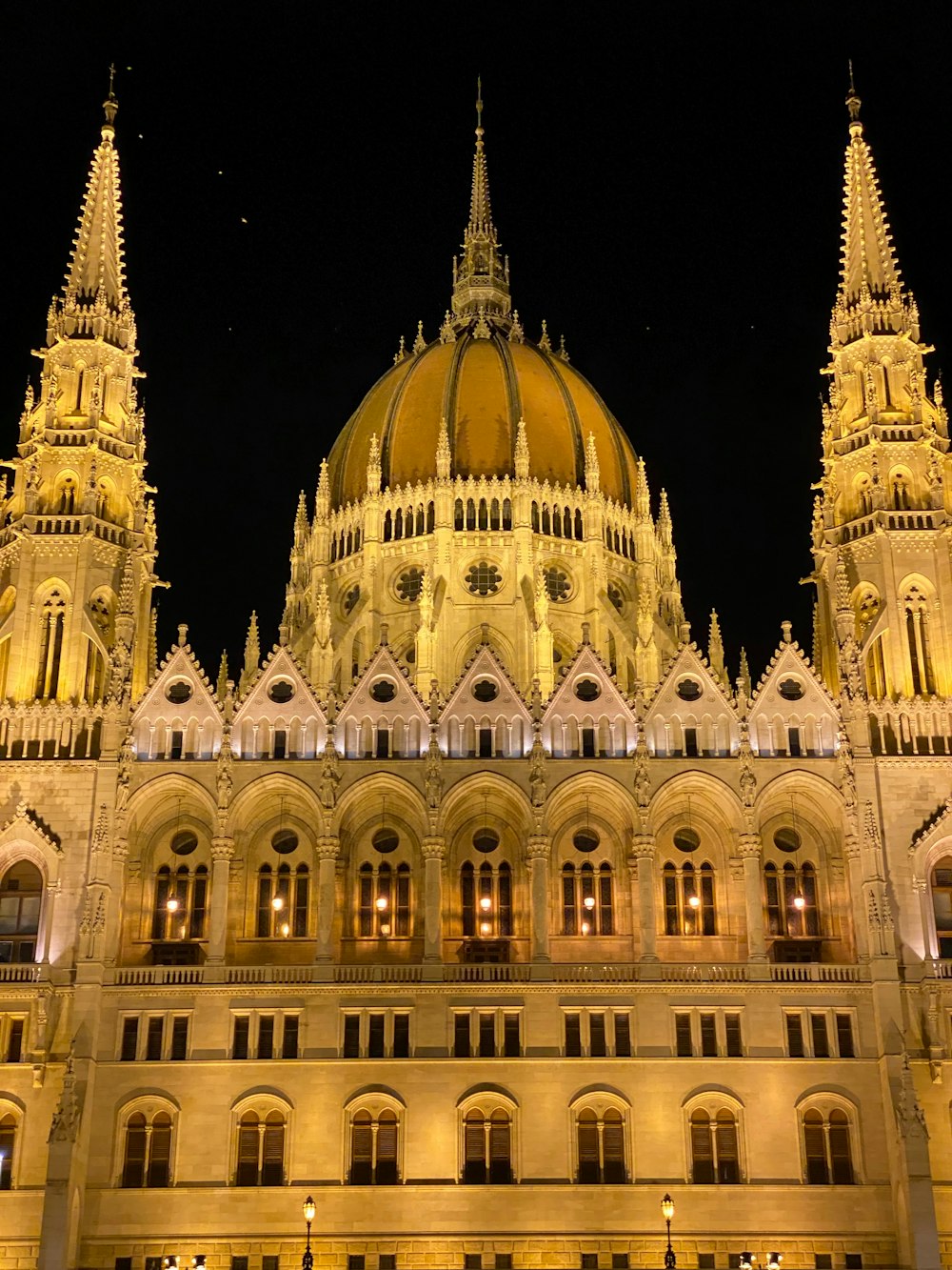 a large building with a golden dome at night