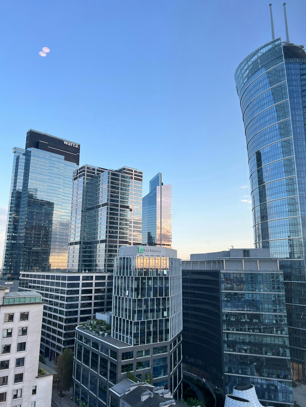 a view of some very tall buildings in a city