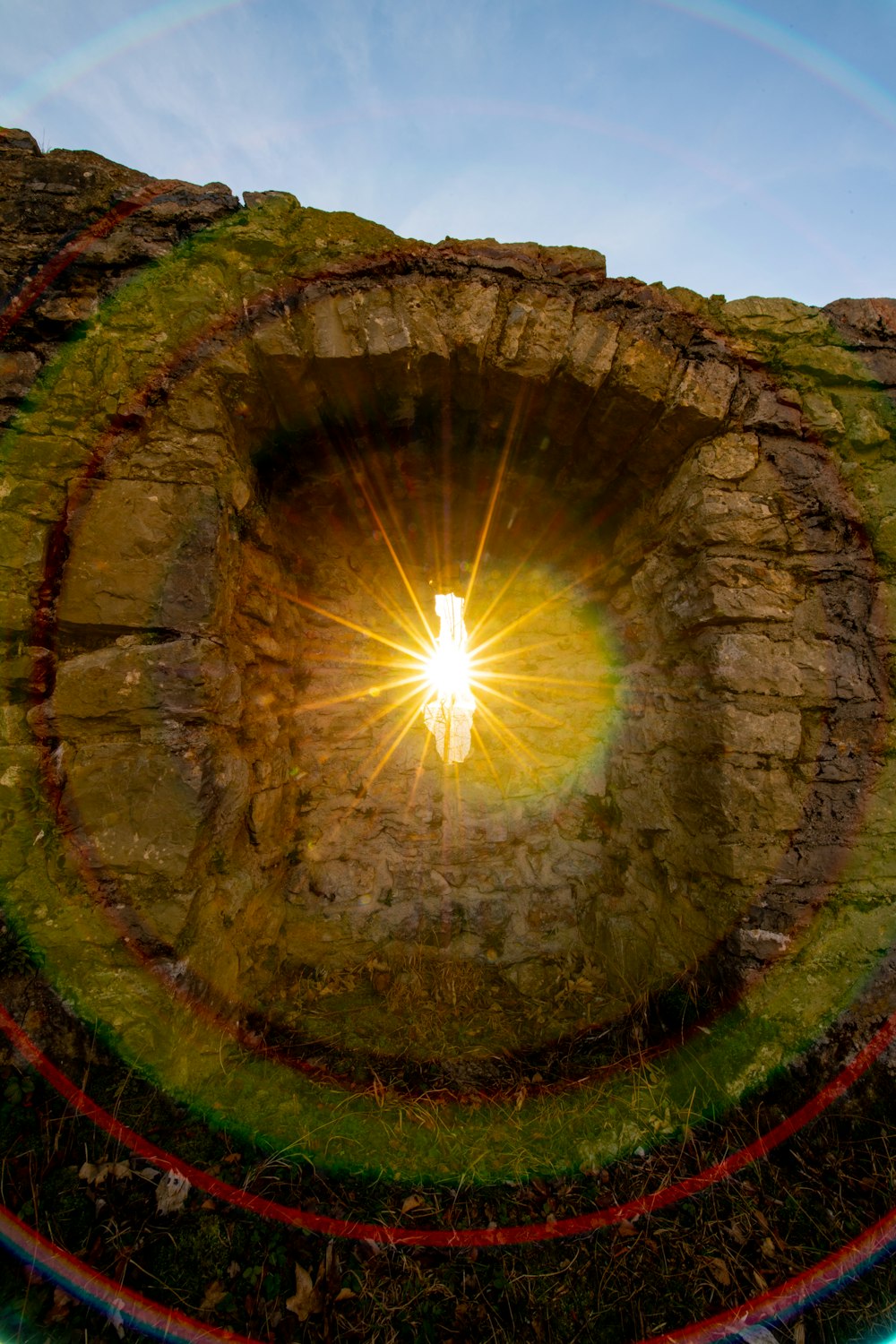 a picture of a light in the middle of a brick wall