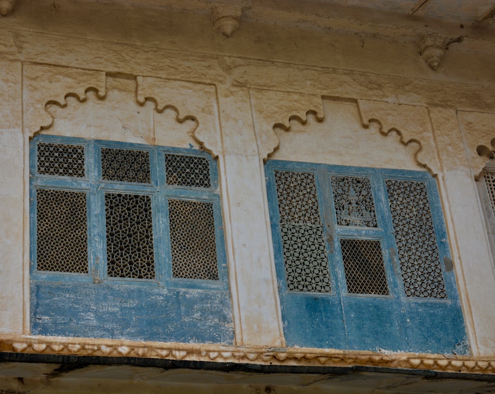 a close up of a building with blue windows