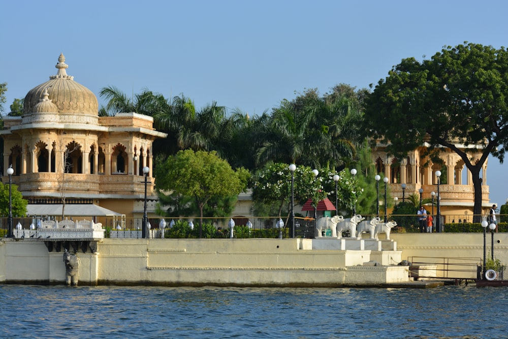 a large body of water with a building in the background