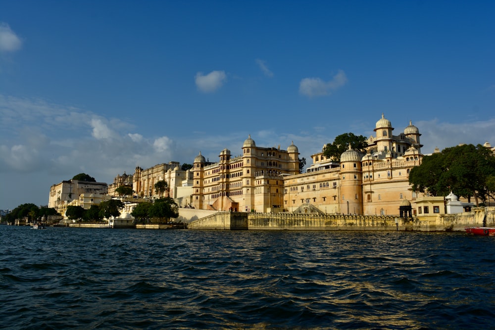 a large building sitting on top of a body of water