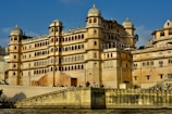 a large building sitting on top of a body of water