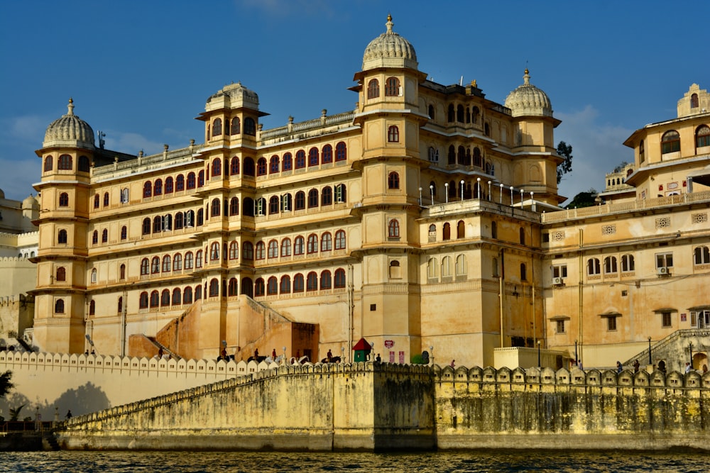 a large building sitting on top of a body of water