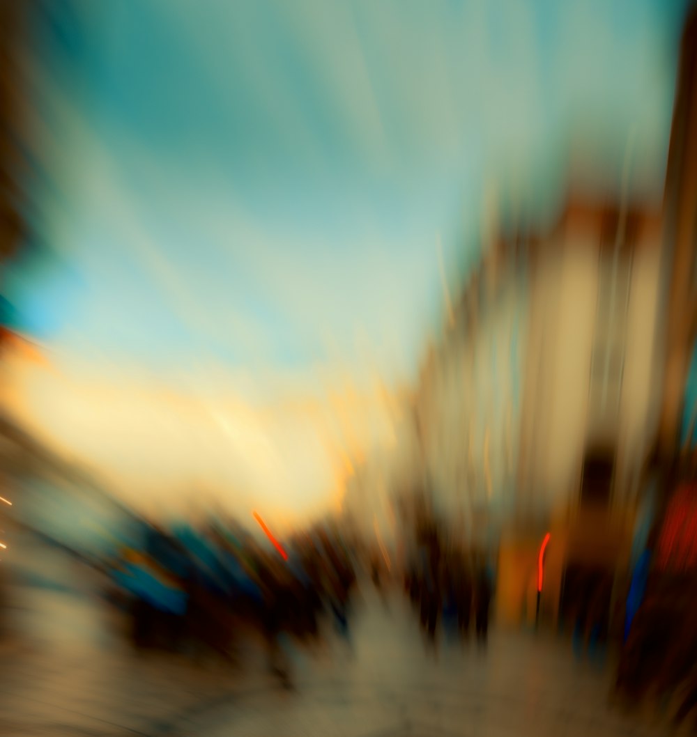 a blurry photo of a street with buildings in the background