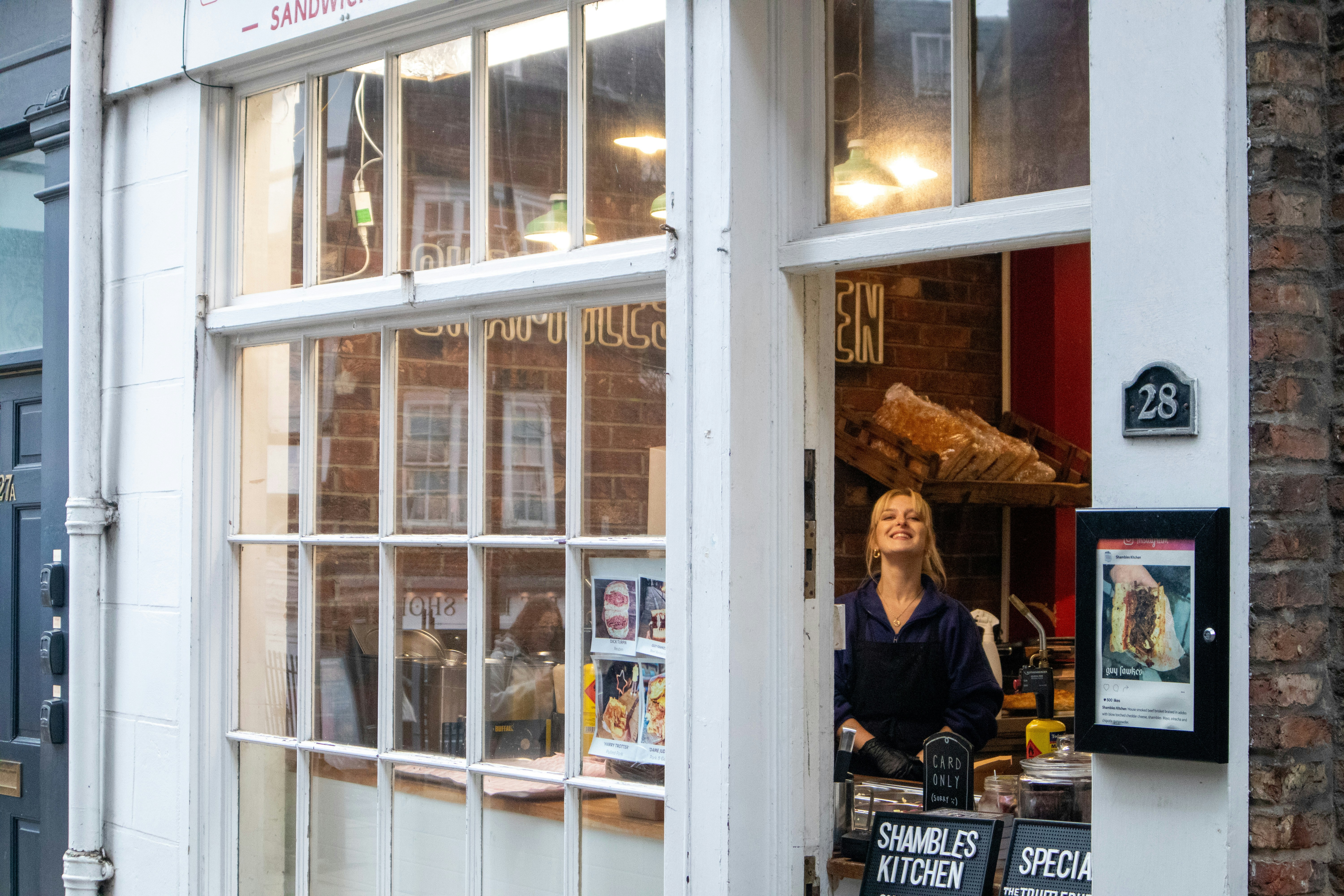 Woman standing in the doorway of a shop