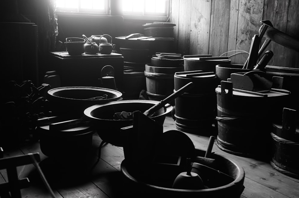 a room filled with lots of barrels and buckets