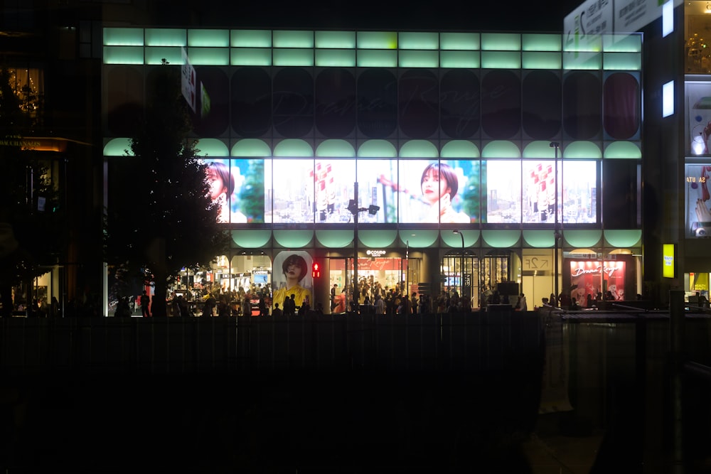 a building with a lot of windows lit up at night