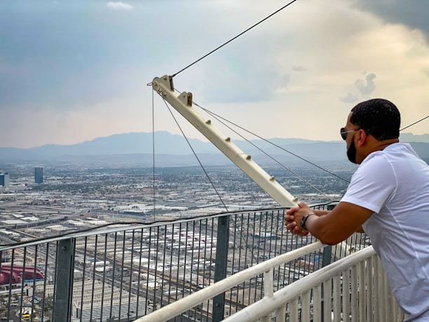 a man standing on top of a tall building