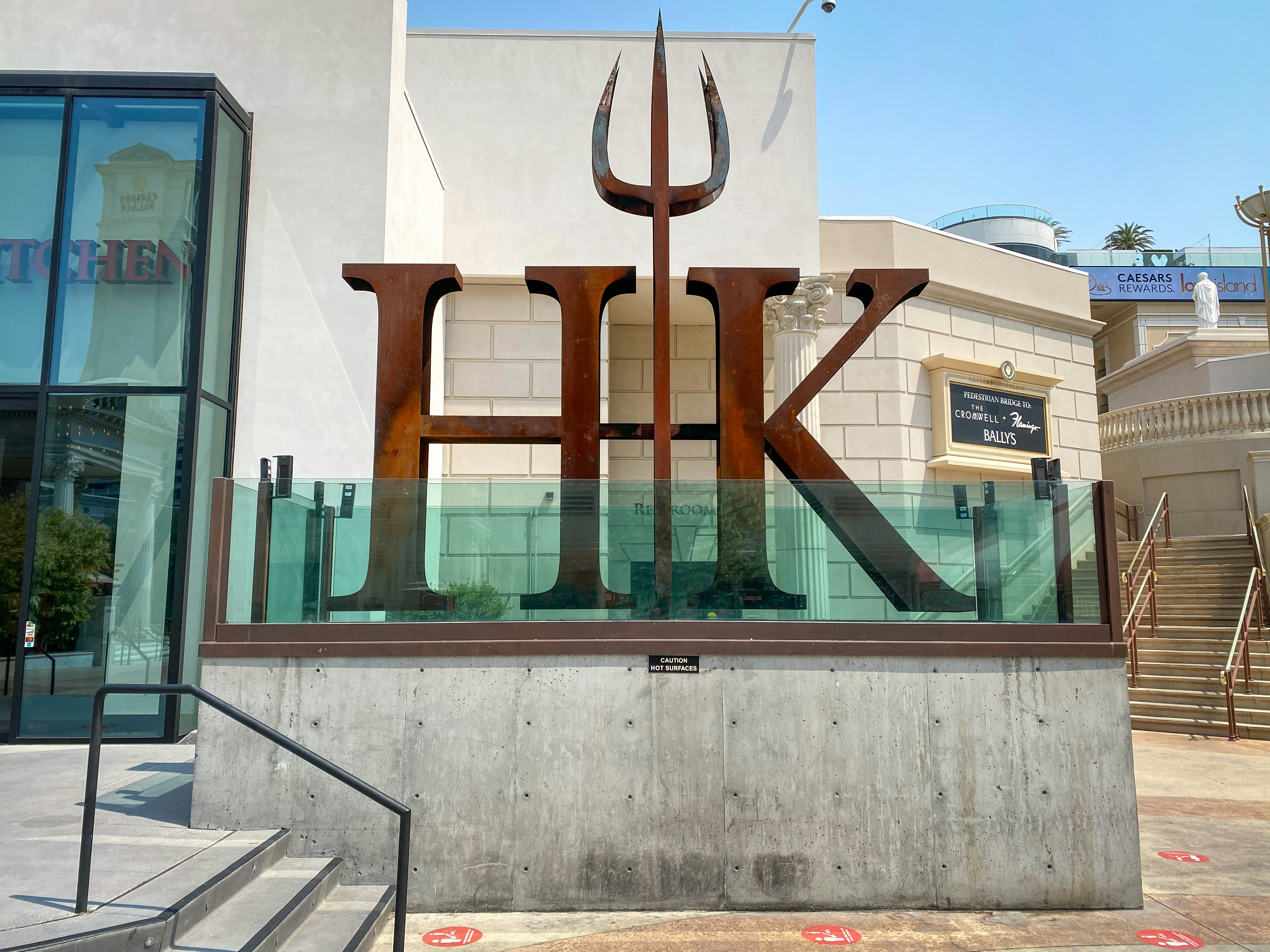 A building with a large metal sign on it's side photo – Free Travel ...