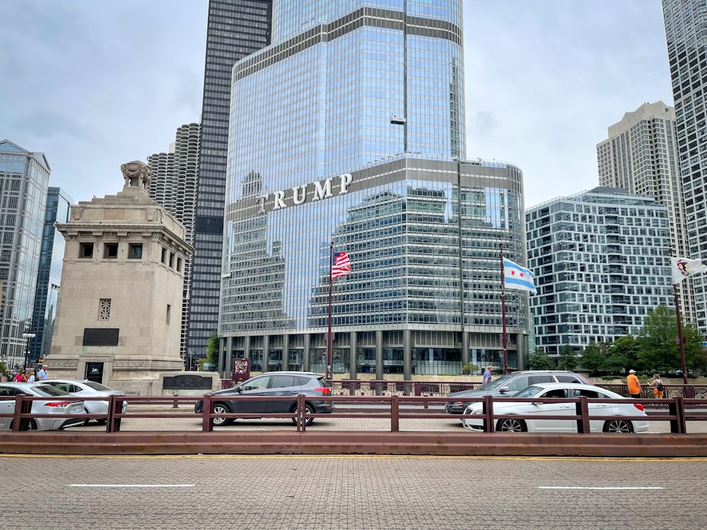 a bunch of cars that are parked in front of some buildings