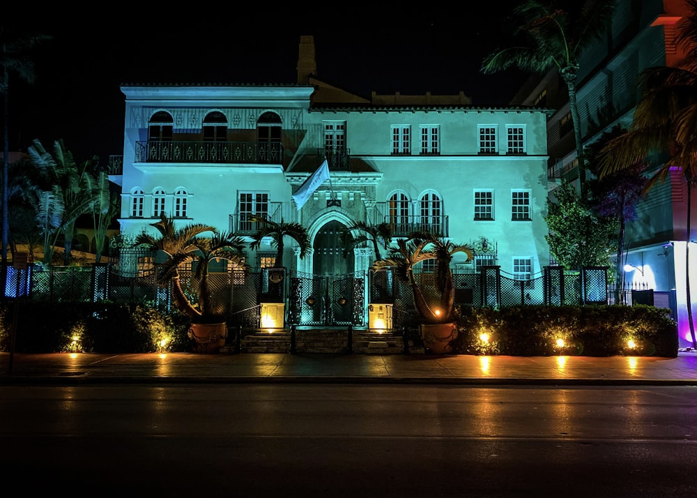 a large white building lit up at night