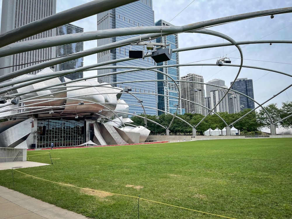 a grassy field with a building in the background