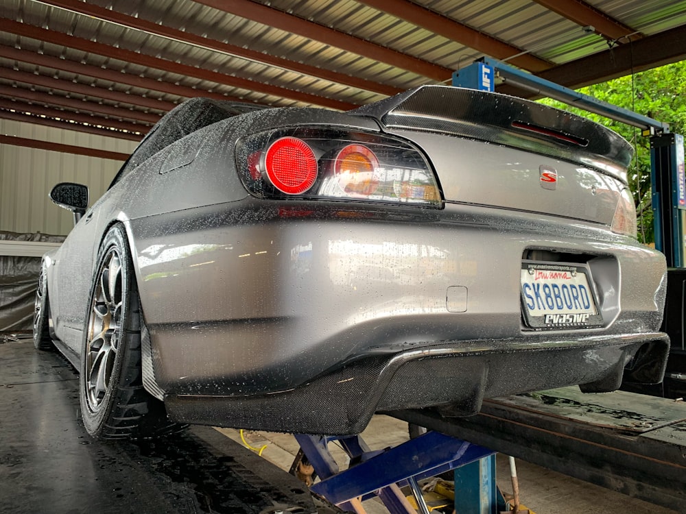 a car is being worked on in a garage