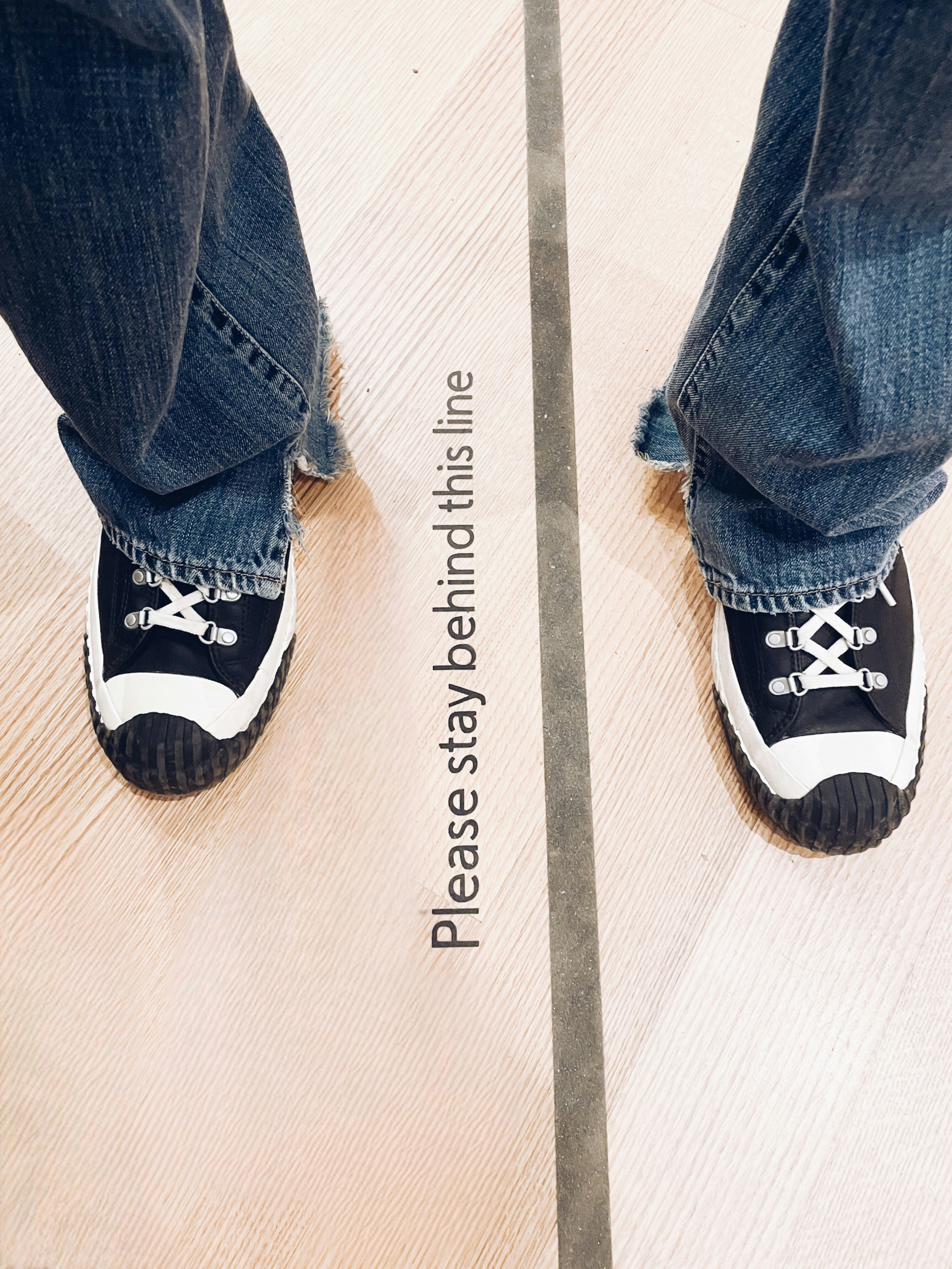 a person standing on top of a wooden floor