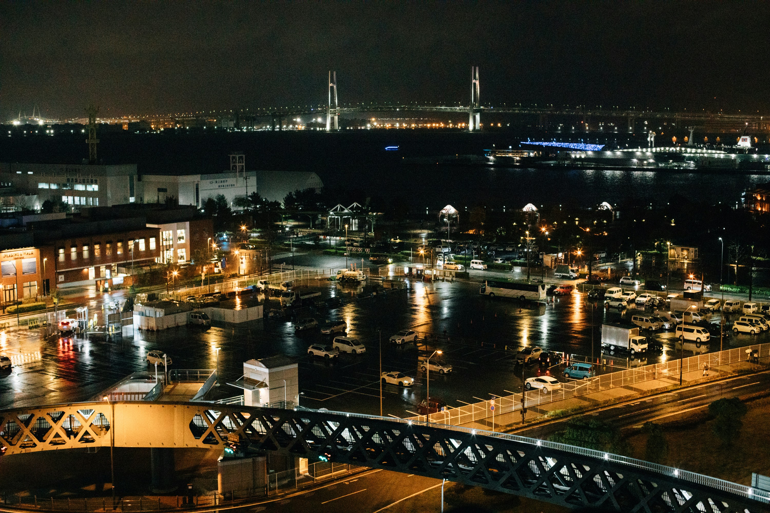 a night view of a city with a bridge