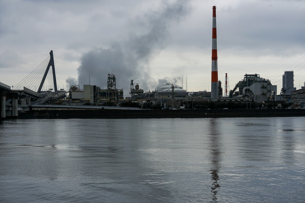 a factory with smoke coming out of it's stacks