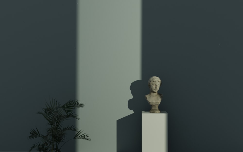 a white sculpture sitting on top of a white pedestal