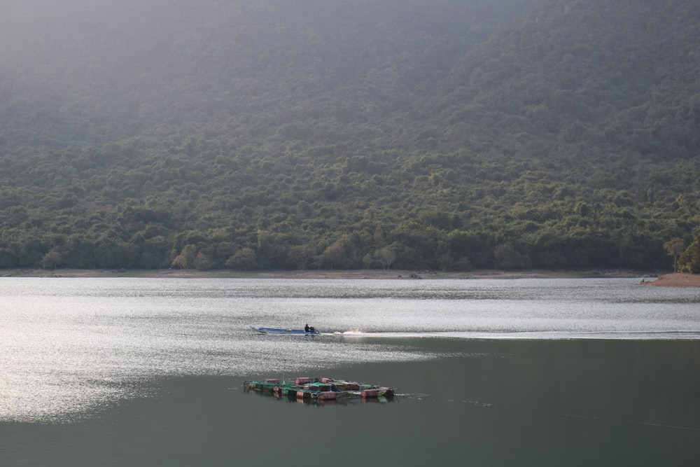 a small boat in a large body of water