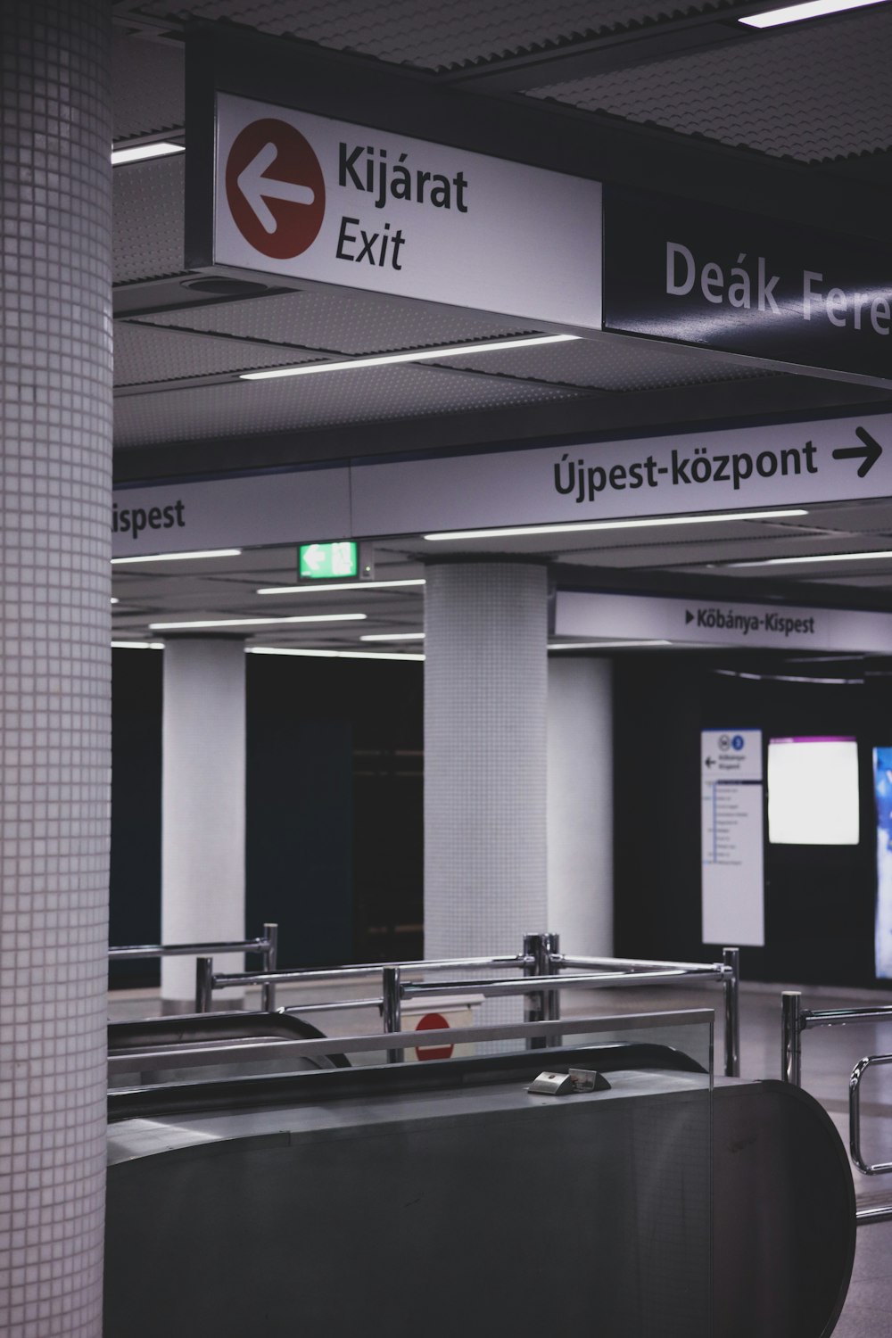 an airport terminal with a conveyor belt for luggage