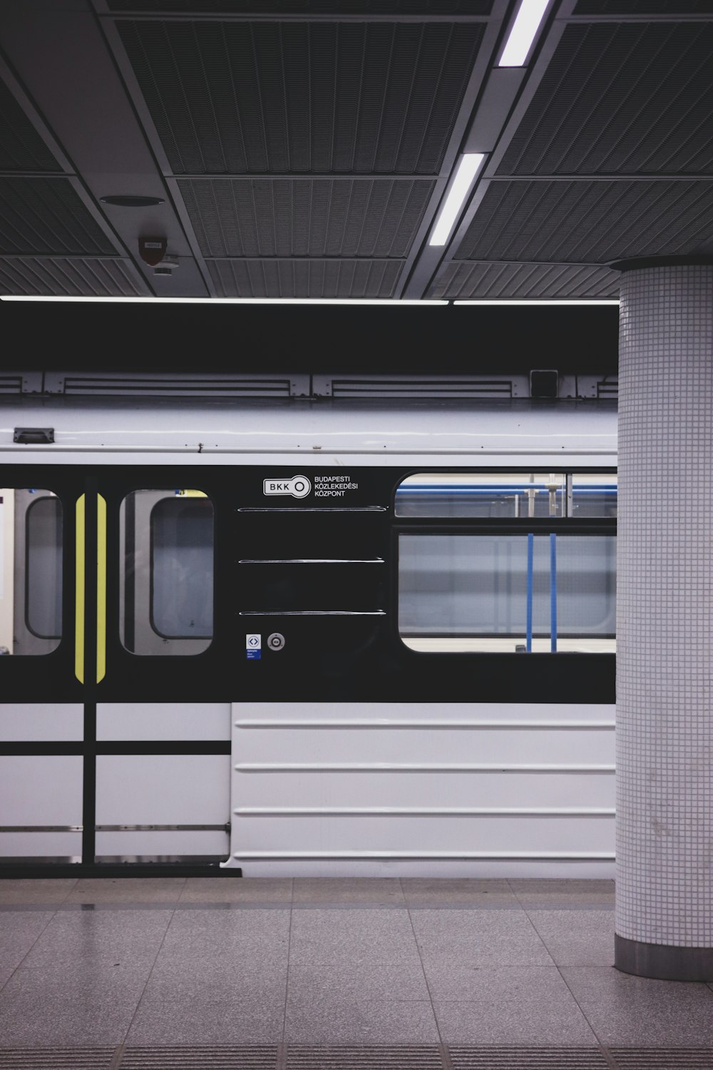 a subway train parked at a train station