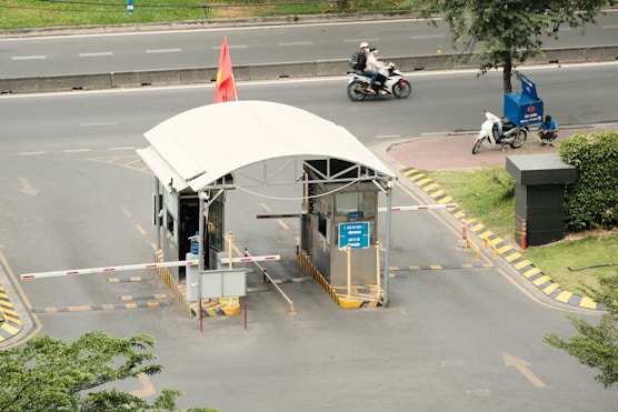 a man riding a motorcycle next to a white tent