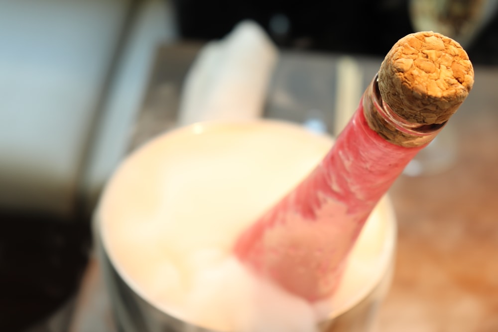 a champagne bottle in a bucket with ice