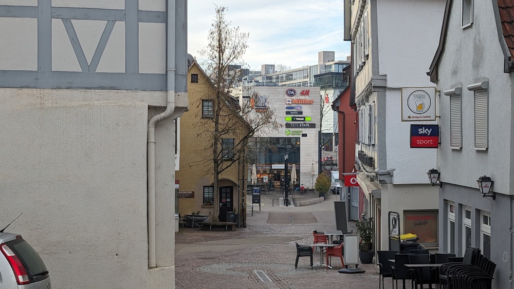 a narrow city street with a few buildings on both sides