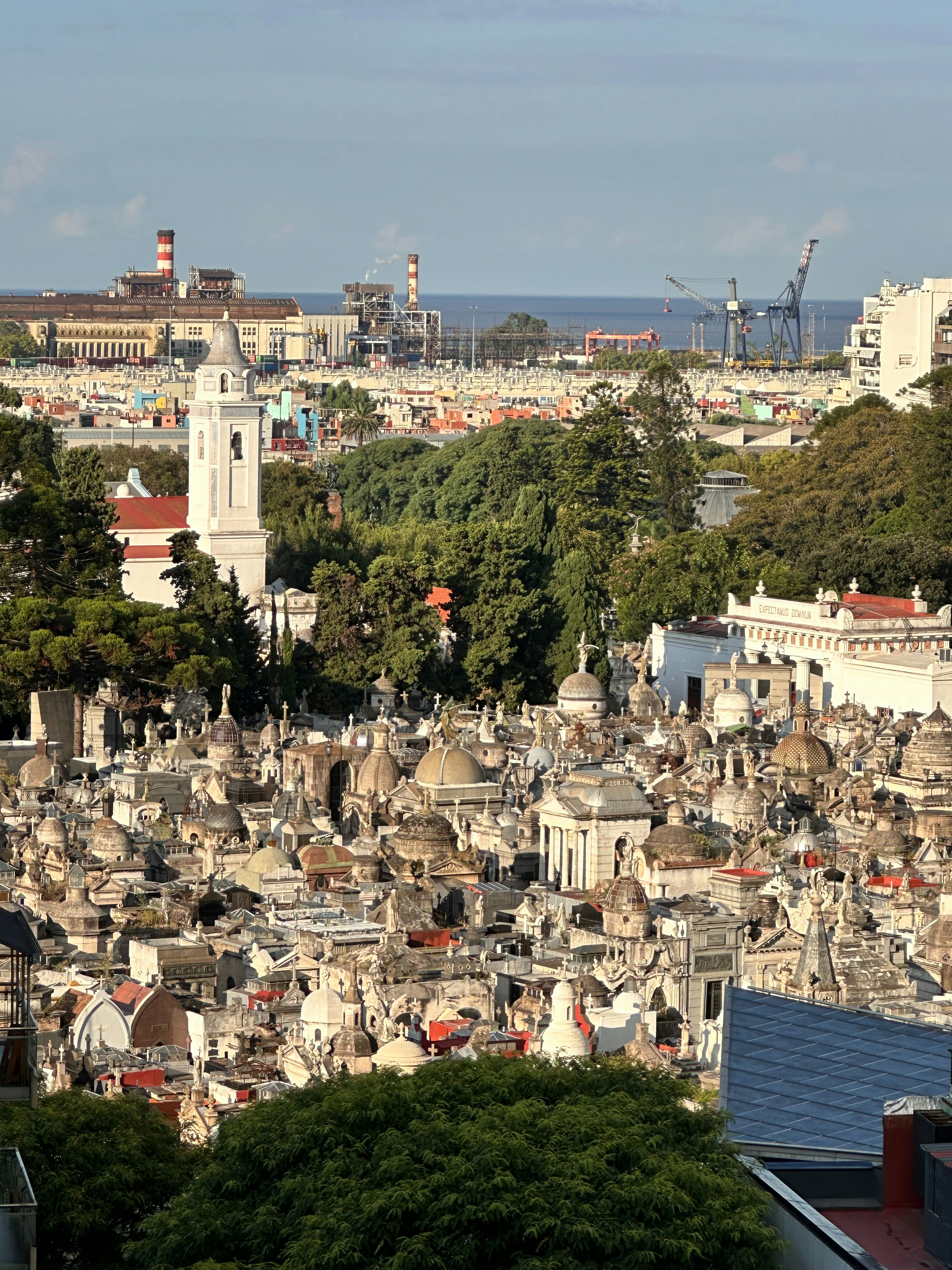 a view of a city with a clock tower in the middle